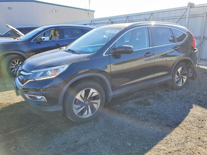 HONDA CR-V TOURI 2016 with VIN 5J6RM4H98GL074324 - Photo from auction