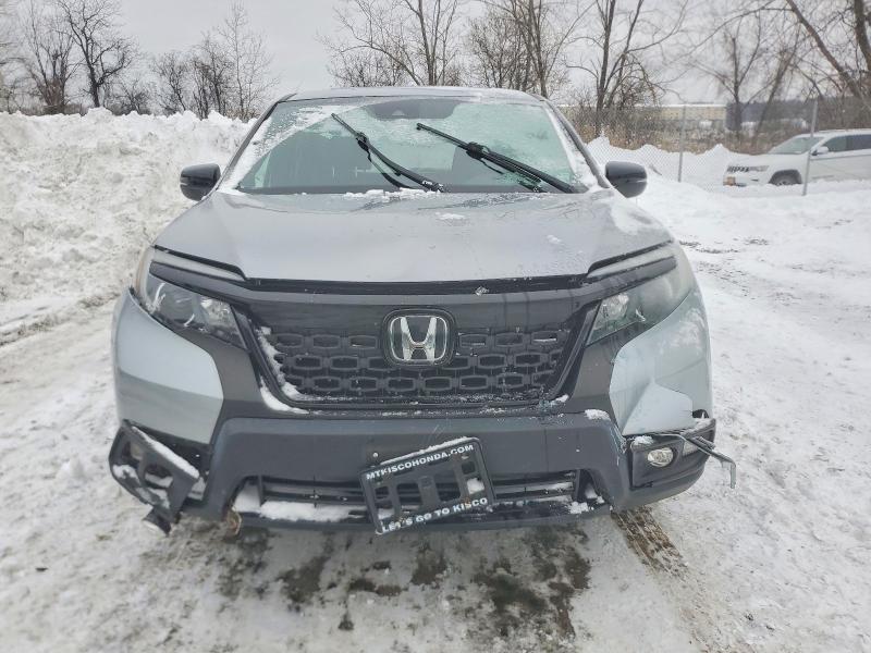 Photo 5 from auction – 2021 HONDA PASSPORT E with VIN 5FNYF8H58MB014302
