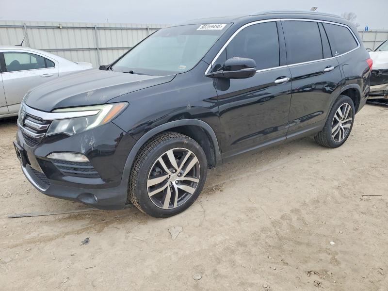 HONDA PILOT TOUR 2016 with VIN 5FNYF6H98GB060255 - Photo from auction