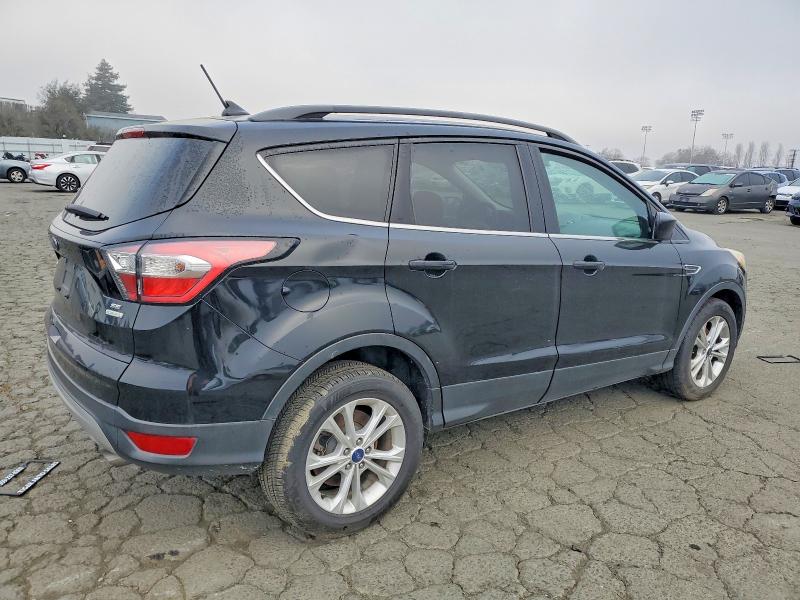 Photo 3 from auction – 2018 FORD ESCAPE SE with VIN 1FMCU0GD0JUA31247