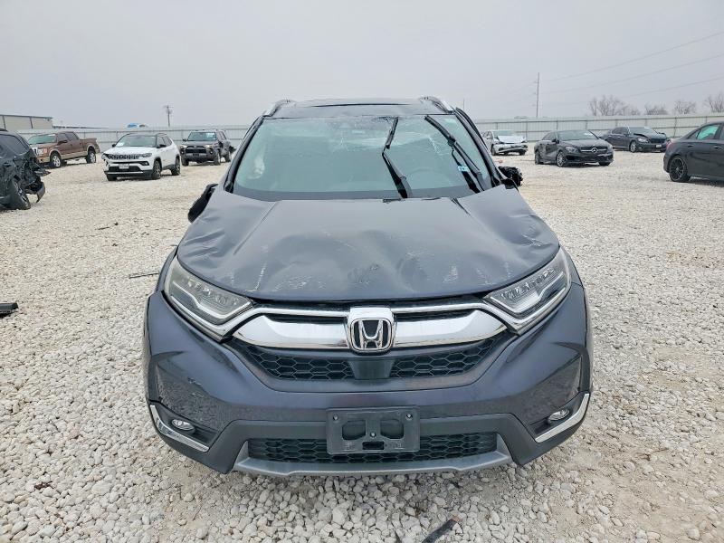 Photo 5 from auction – 2017 HONDA CR-V with VIN 7FARW1H9XHE035032