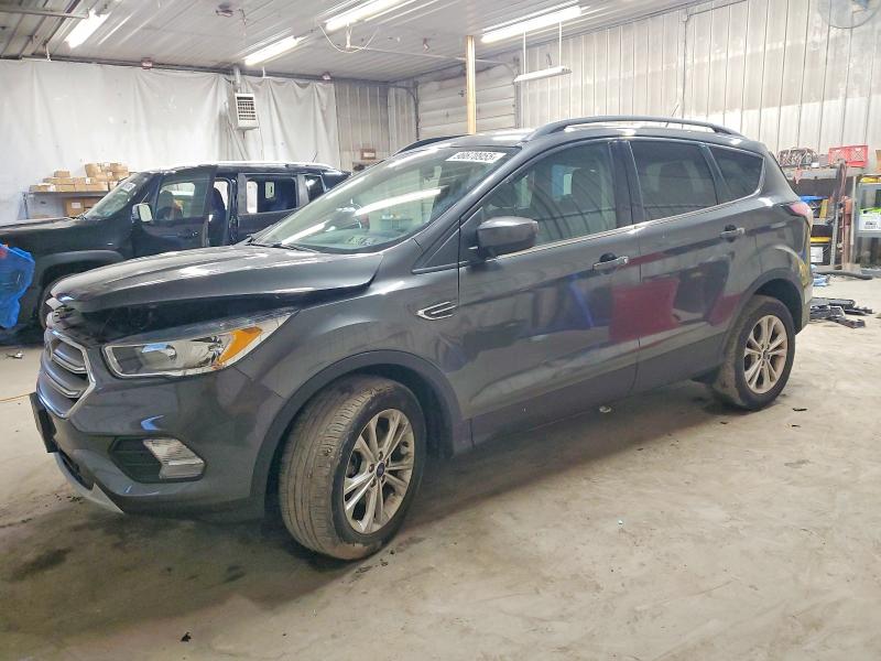 FORD ESCAPE 2018 with VIN 1FMCU9GD7JUC60965 - Photo from auction
