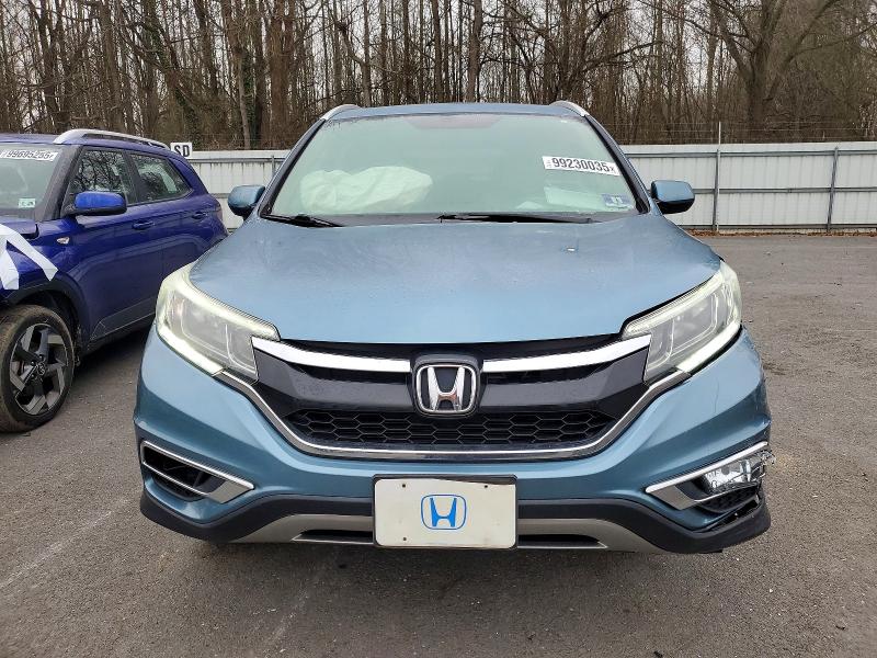 Photo 5 from auction – 2015 HONDA CR-V with VIN 5J6RM4H73FL050042