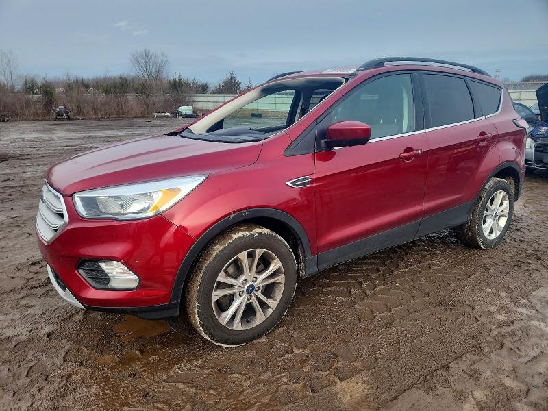 FORD ESCAPE SE 2018 with VIN 1FMCU9GD9JUD53163 - Photo from auction