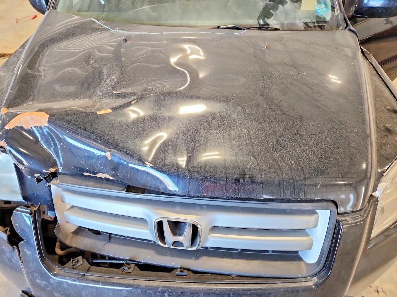 Photo 12 from auction – 2006 HONDA PILOT EX with VIN 2HKYF18476H543954