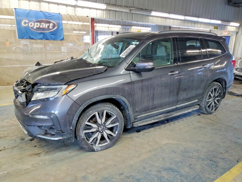 HONDA PILOT TOUR 2019 with VIN 5FNYF6H97KB082059 - Photo from auction