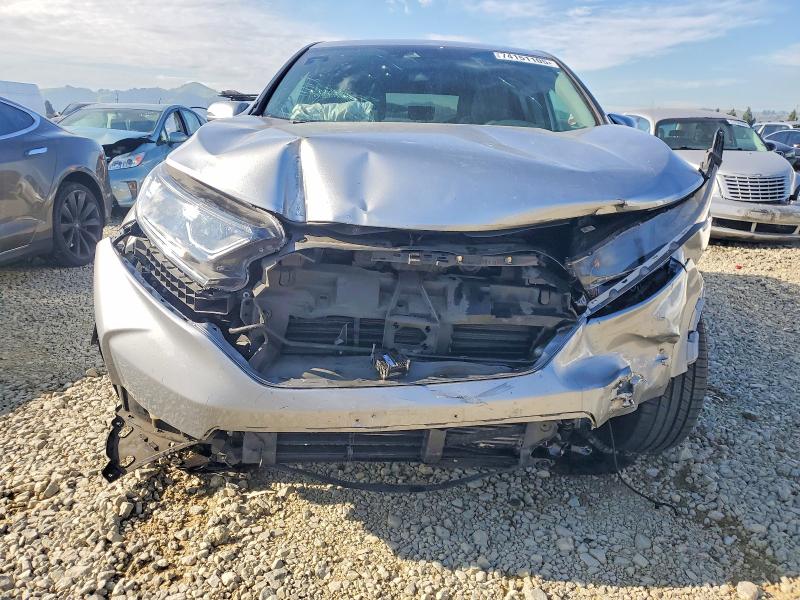 Photo 5 from auction – 2018 HONDA CR-V with VIN 7FARW2H50JE024159