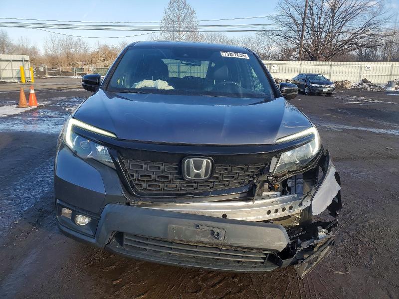 Photo 5 from auction – 2021 HONDA PASSPORT E with VIN 5FNYF8H57MB013917