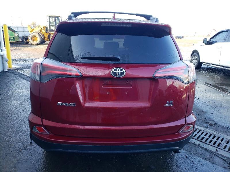 Photo 6 from auction – 2018 TOYOTA RAV4 LE with VIN 2T3BFREV6JW819625