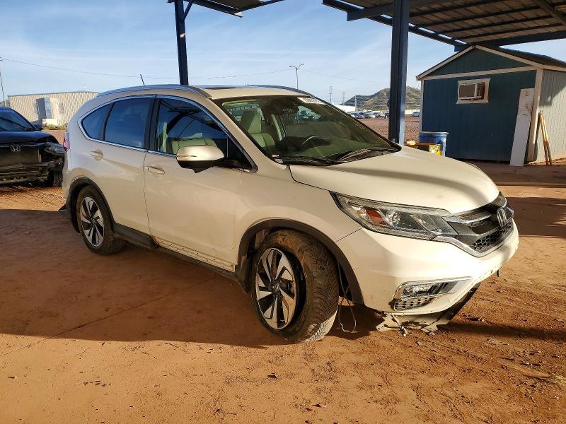 Photo 4 from auction – 2015 HONDA CR-V with VIN 5J6RM4H98FL084124