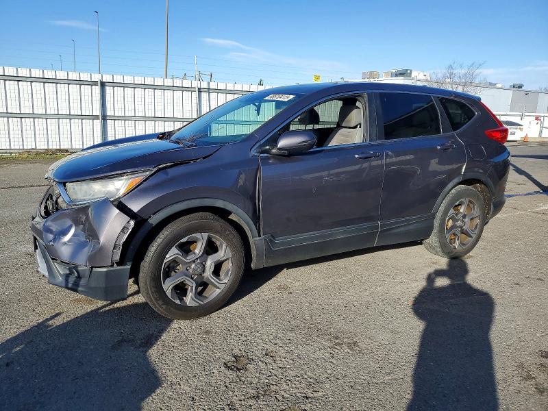 Photo 1 from auction – 2018 HONDA CR-V with VIN 7FARW1H5XJE024552