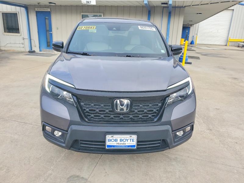 Photo 5 from auction – 2021 HONDA PASSPORT E with VIN 5FNYF7H57MB005861