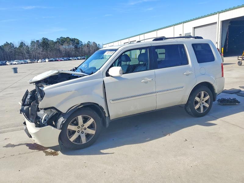 HONDA PILOT TOUR 2014 with VIN 5FNYF4H97EB034084 - Photo from auction