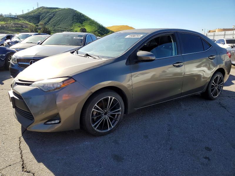 TOYOTA COROLLA LE 2017 with VIN 5YFBPRHE2HP571855 - Photo from auction