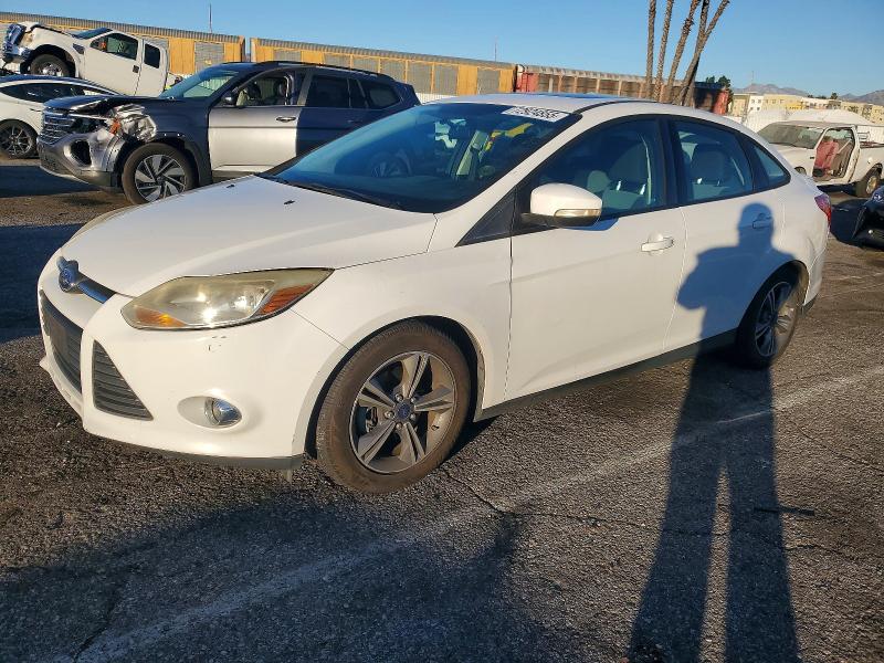 FORD FOCUS SE 2014 with VIN 1FADP3F24EL406379 - Photo from auction