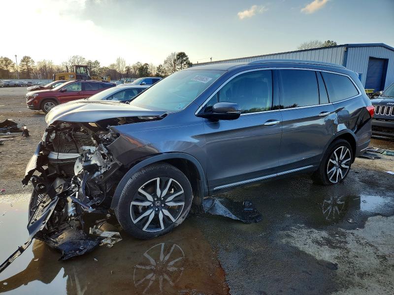 HONDA PILOT TOUR 2020 with VIN 5FNYF5H96LB024455 - Photo from auction