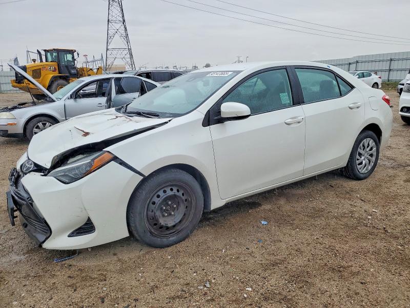 TOYOTA COROLLA 2018 with VIN 5YFBURHE6JP775265 - Photo from auction