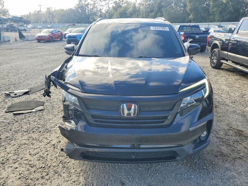 Photo 5 from auction – 2022 HONDA PILOT SE with VIN 5FNYF6H21NB101275