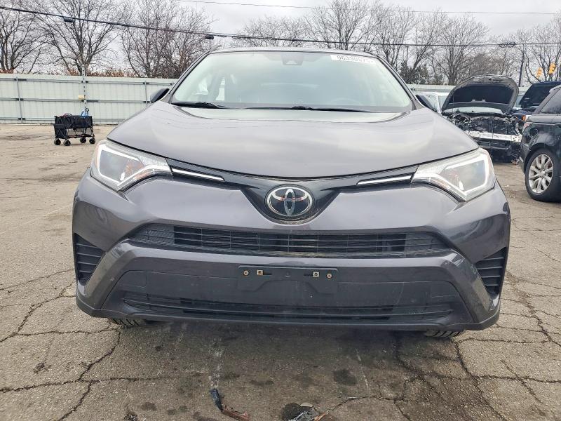 Photo 5 from auction – 2018 TOYOTA RAV4 LE with VIN JTMZFREV6JJ159129