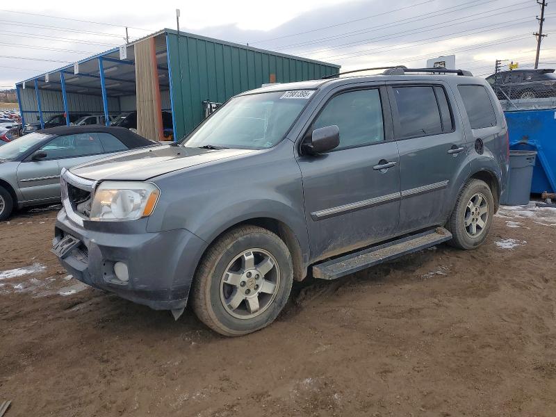 HONDA PILOT TOUR 2011 with VIN 5FNYF4H95BB015397 - Photo from auction