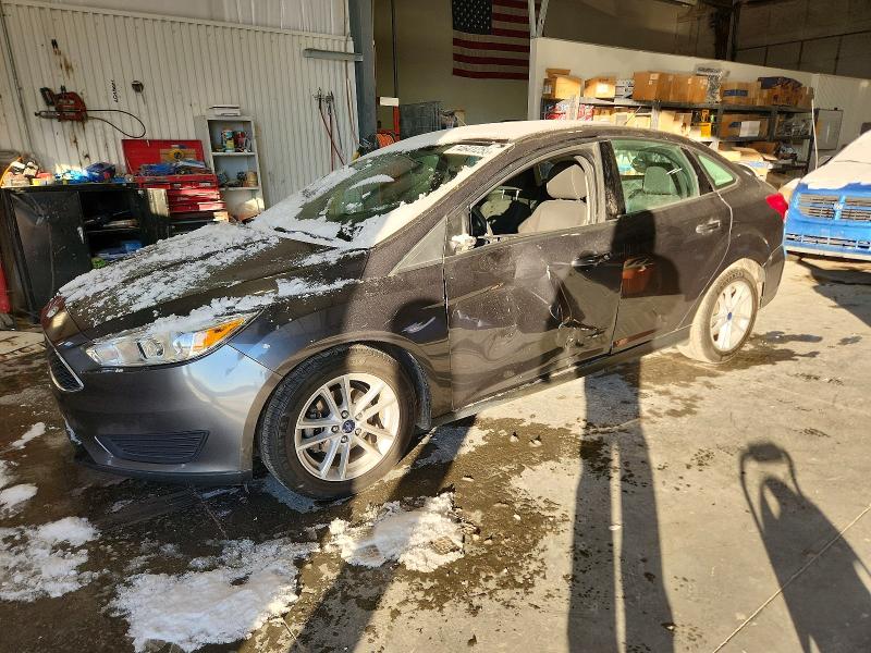 FORD FOCUS SE 2017 with VIN 1FADP3F21HL317356 - Photo from auction
