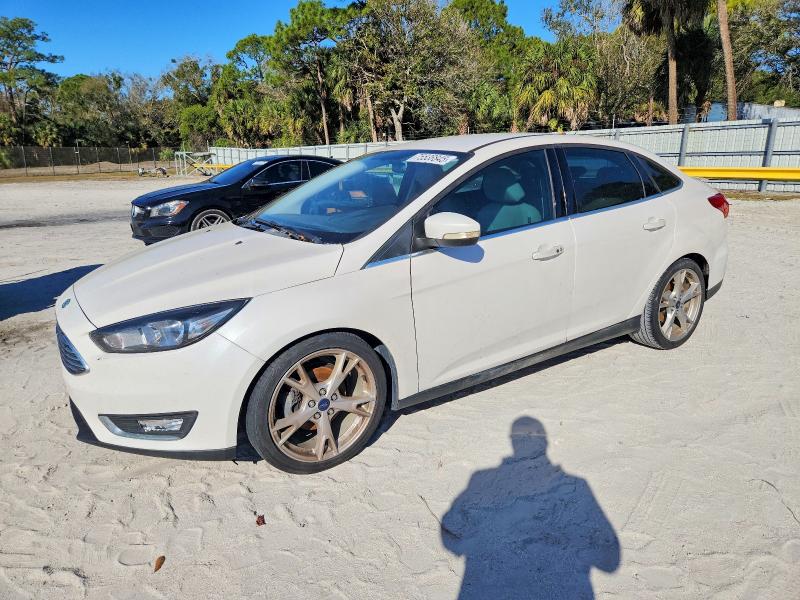 FORD FOCUS TITA 2015 with VIN 1FADP3J21FL286257 - Photo from auction