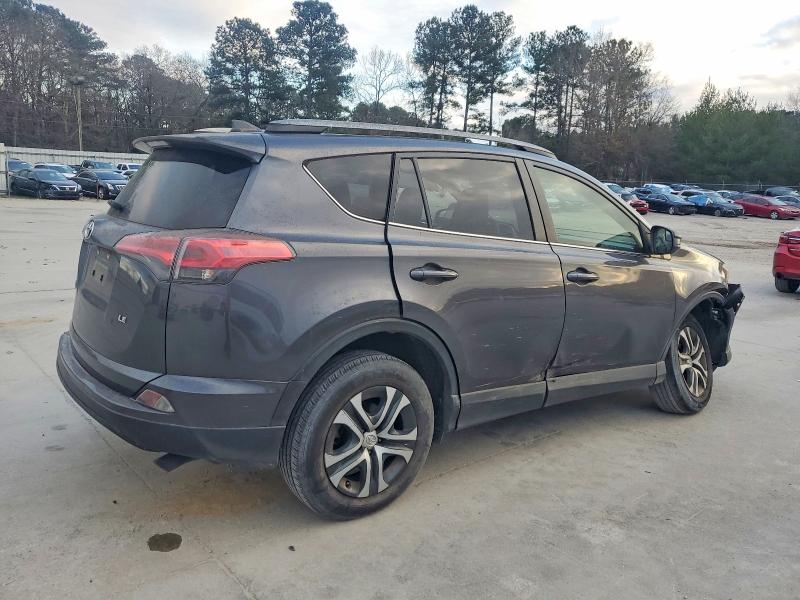 Photo 3 from auction – 2018 TOYOTA RAV4 LE with VIN JTMZFREV6JJ211147