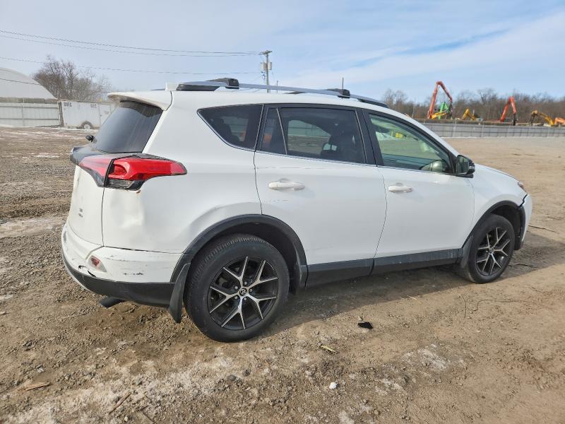 Photo 3 from auction – 2018 TOYOTA RAV4 SE with VIN JTMJFREV2JJ223843