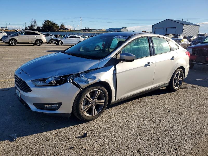 FORD FOCUS SE 2018 with VIN 1FADP3FE5JL224050 - Photo from auction