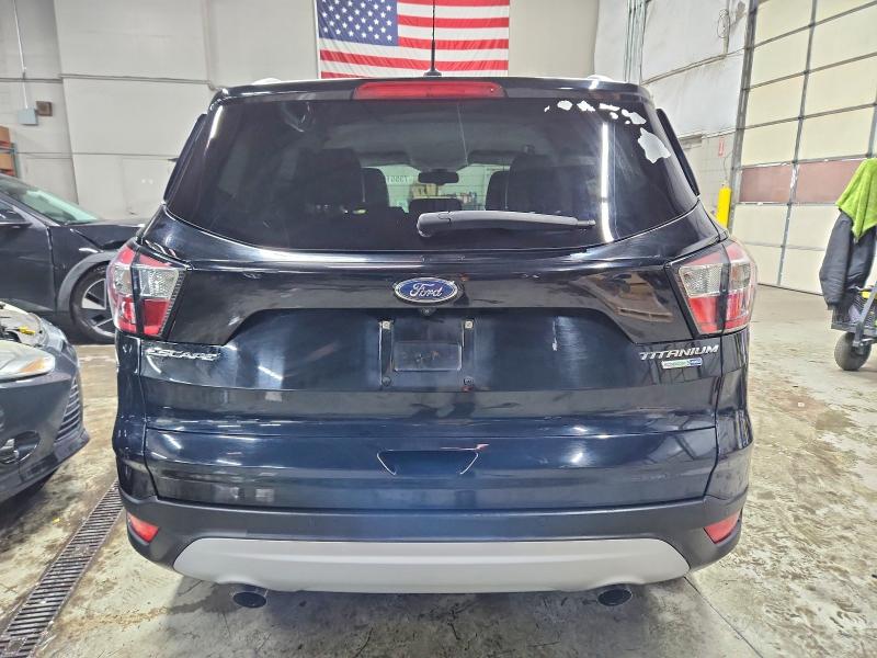 Foto 6 de la subasta – 2017 FORD ESCAPE TIT con VIN 1FMCU9J98HUE95650