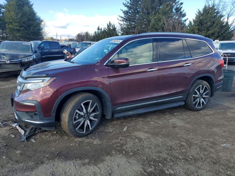 HONDA PILOT TOUR 2021 with VIN 5FNYF6H60MB036680 - Photo from auction