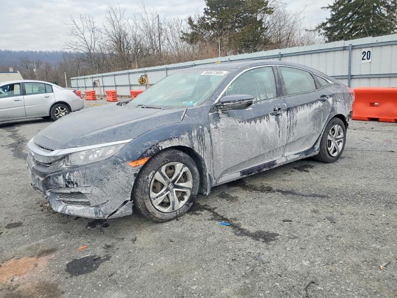 HONDA CIVIC LX 2018 with VIN 19XFC2F55JE028787 - Photo from auction