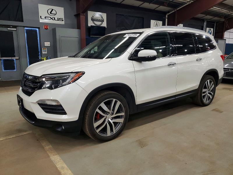 HONDA PILOT TOUR 2016 with VIN 5FNYF6H93GB054508 - Photo from auction