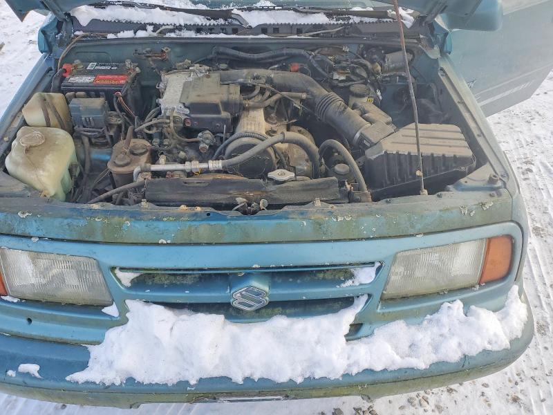 Photo 12 from auction – 1997 SUZUKI SIDEKICK J with VIN 2S3TA02C7V6408397