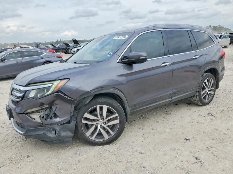 HONDA PILOT TOUR 2017 with VIN 5FNYF5H91HB020742 - Photo from auction