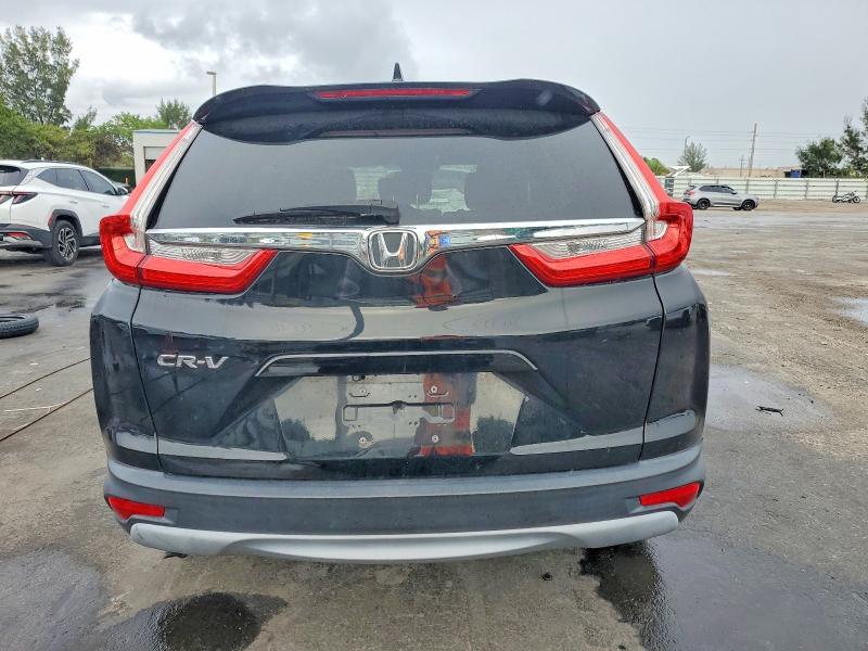 Photo 6 from auction – 2018 HONDA CR-V with VIN 7FARW1H53JE007754