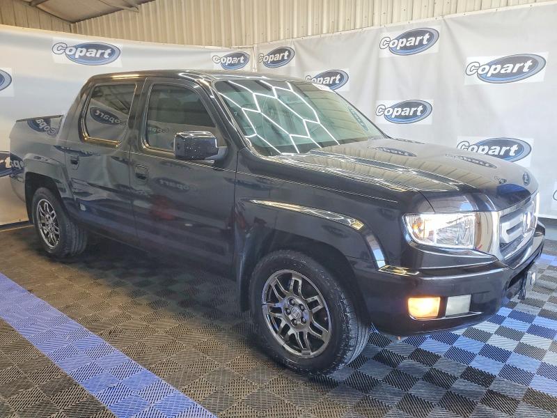 Photo 4 from auction – 2011 HONDA RIDGELINE with VIN 5FPYK1F50BB452435