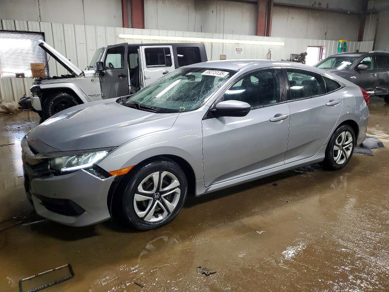 HONDA CIVIC LX 2018 with VIN 19XFC2F50JE038384 - Photo from auction
