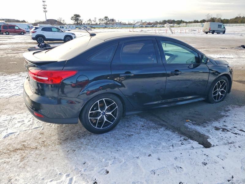 Photo 3 from auction – 2016 FORD FOCUS with VIN 1FADP3F25GL237055