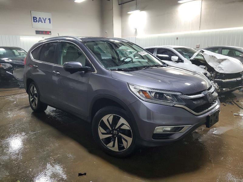 Photo 4 from auction – 2015 HONDA CR-V TOURI with VIN 5J6RM4H95FL118097