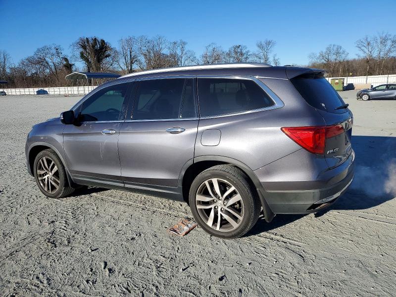 Photo 2 from auction – 2016 HONDA PILOT TOUR with VIN 5FNYF5H95GB034707
