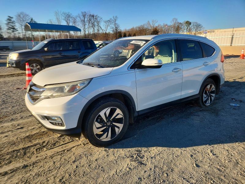 HONDA CR-V TOURI 2015 with VIN 5J6RM3H94FL020446 - Photo from auction