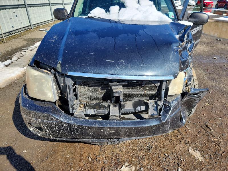 Photo 12 from auction – 2006 GMC ENVOY with VIN 1GKDT13S362320328