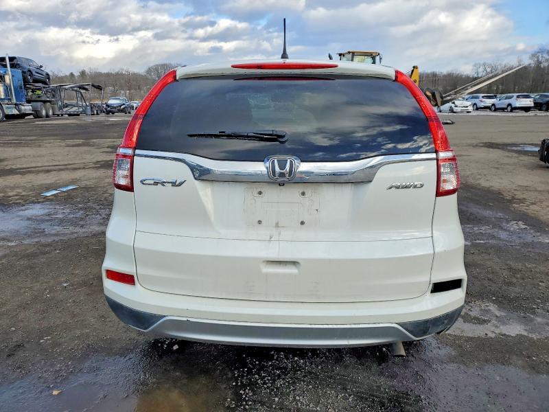 Photo 6 from auction – 2015 HONDA CR-V with VIN 5J6RM4H57FL043612