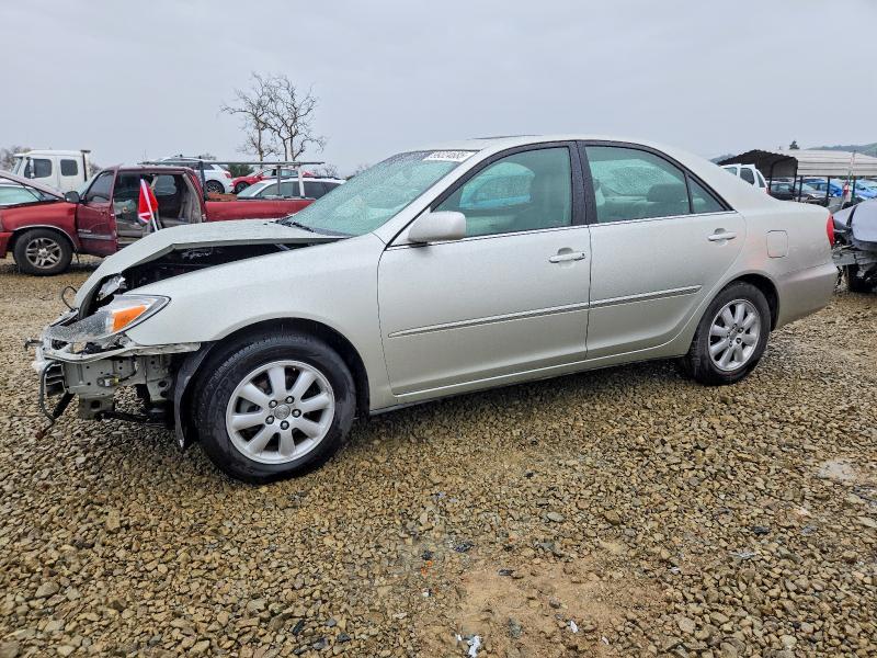 TOYOTA CAMRY LE 2002 with VIN JTDBE30K320056403 - Photo from auction