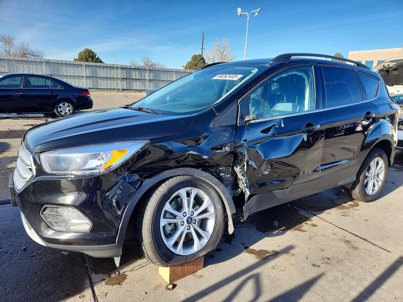 FORD ESCAPE SE 2018 with VIN 1FMCU9GDXJUB75649 - Photo from auction
