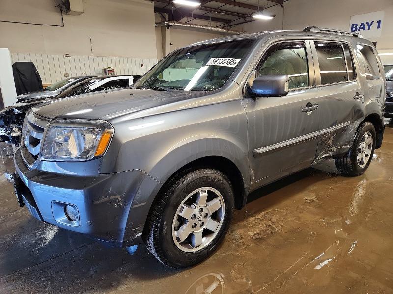 HONDA PILOT TOUR 2011 with VIN 5FNYF4H94BB090897 - Photo from auction