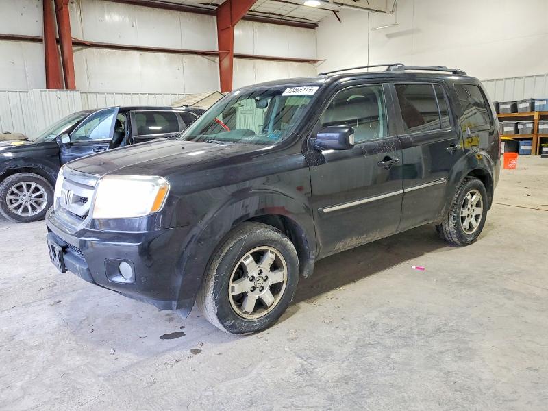 HONDA PILOT TOUR 2011 with VIN 5FNYF4H99BB003236 - Photo from auction