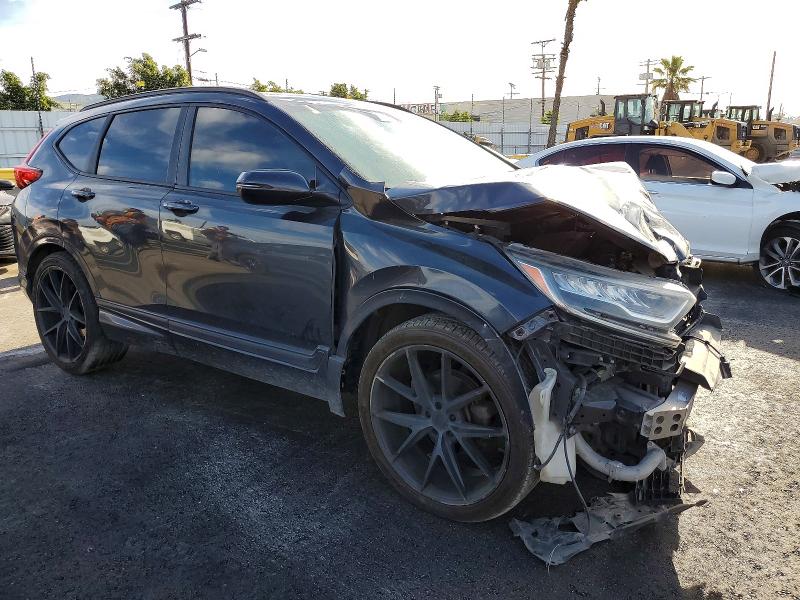 Photo 4 from auction – 2017 HONDA CRV with VIN 7FARW1H9XHE025925