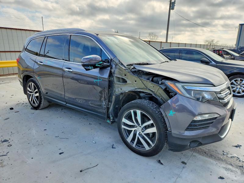 Photo 4 from auction – 2016 HONDA PILOT TOUR with VIN 5FNYF5H9XGB003355